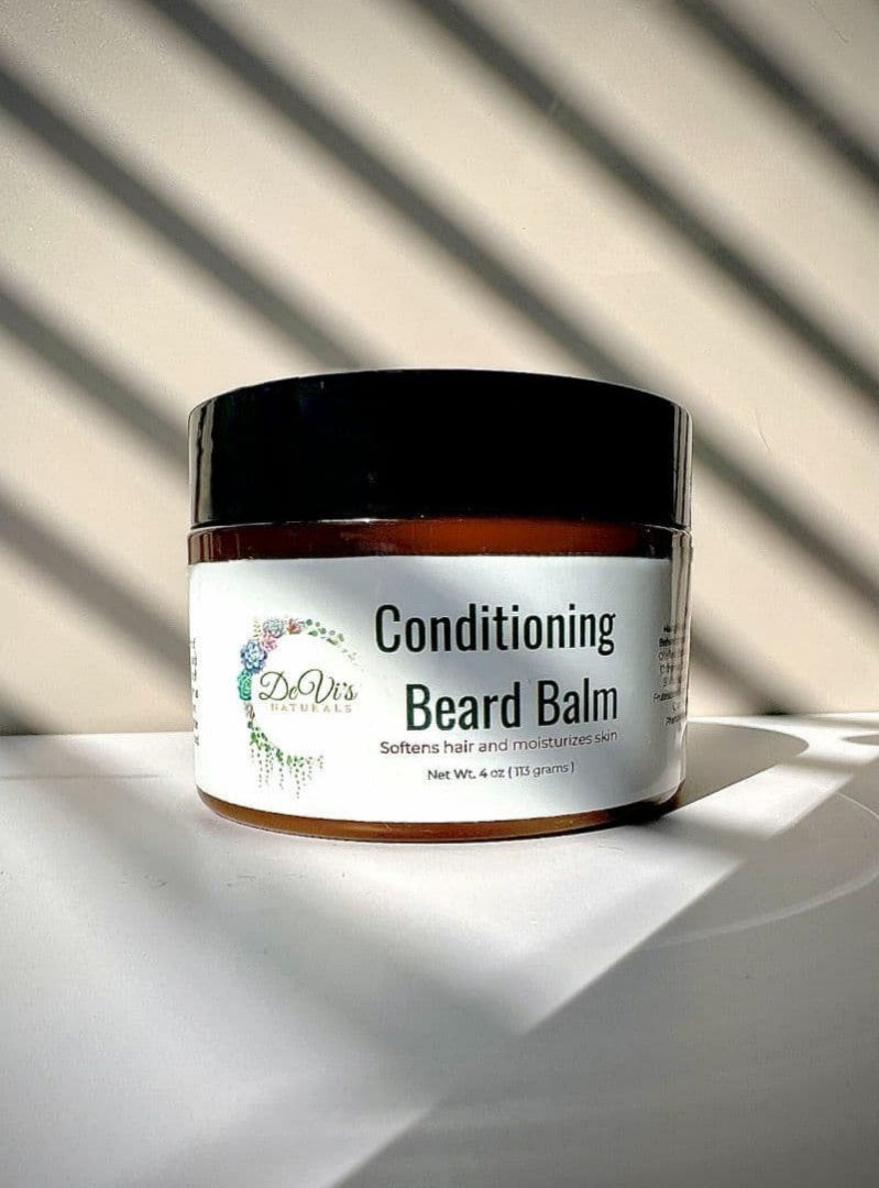 Jar of conditioning beard balm with a label on a light background