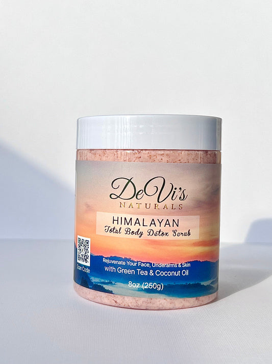 A container of De Vi's Naturals Himalayan Total Body Detox Scrub with pink Himalayan salt visible through the clear portion of the container.