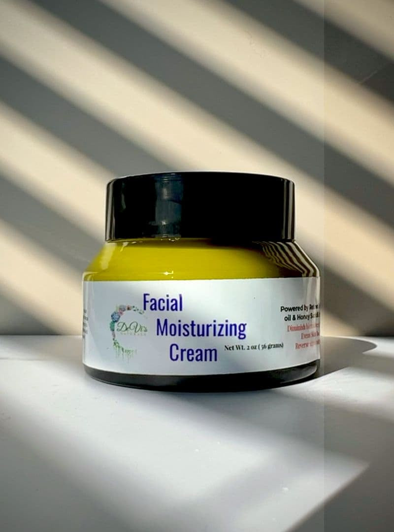 Jar of facial moisturizing cream on a white surface with a striped background