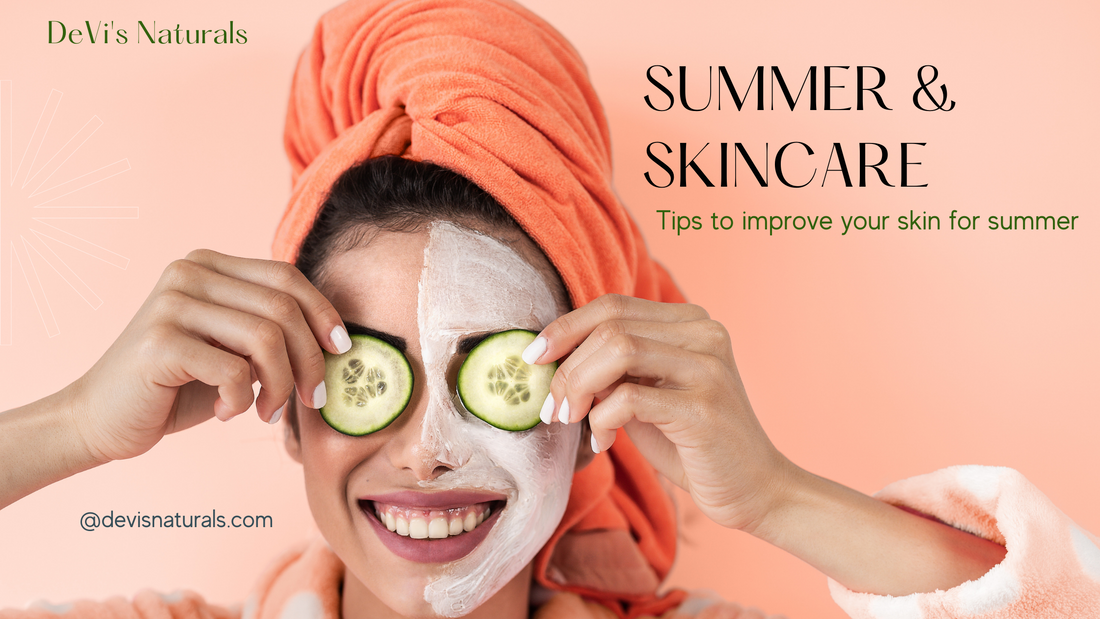 Beautiful caucasian woman with white facial mask covering half of face wearing  orange headwrap on head smiling while holding two cucumber slices on her eyes