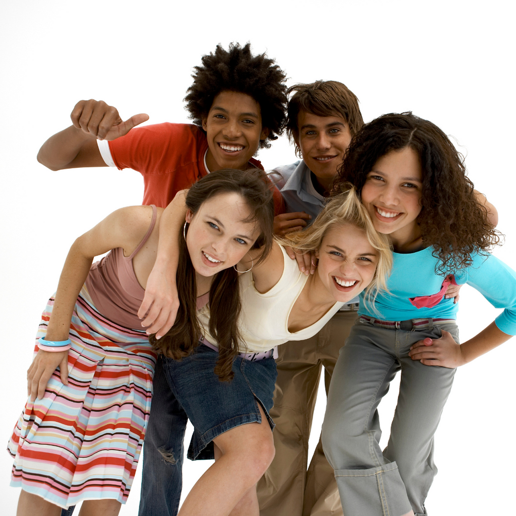 group photo of teens of different ethnicities smiling for a group photo 