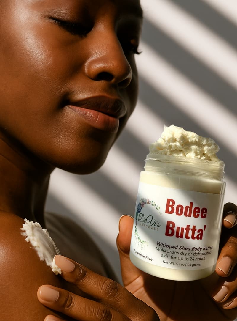 Person applying Bodee Butta whipped shea body butter to their skin