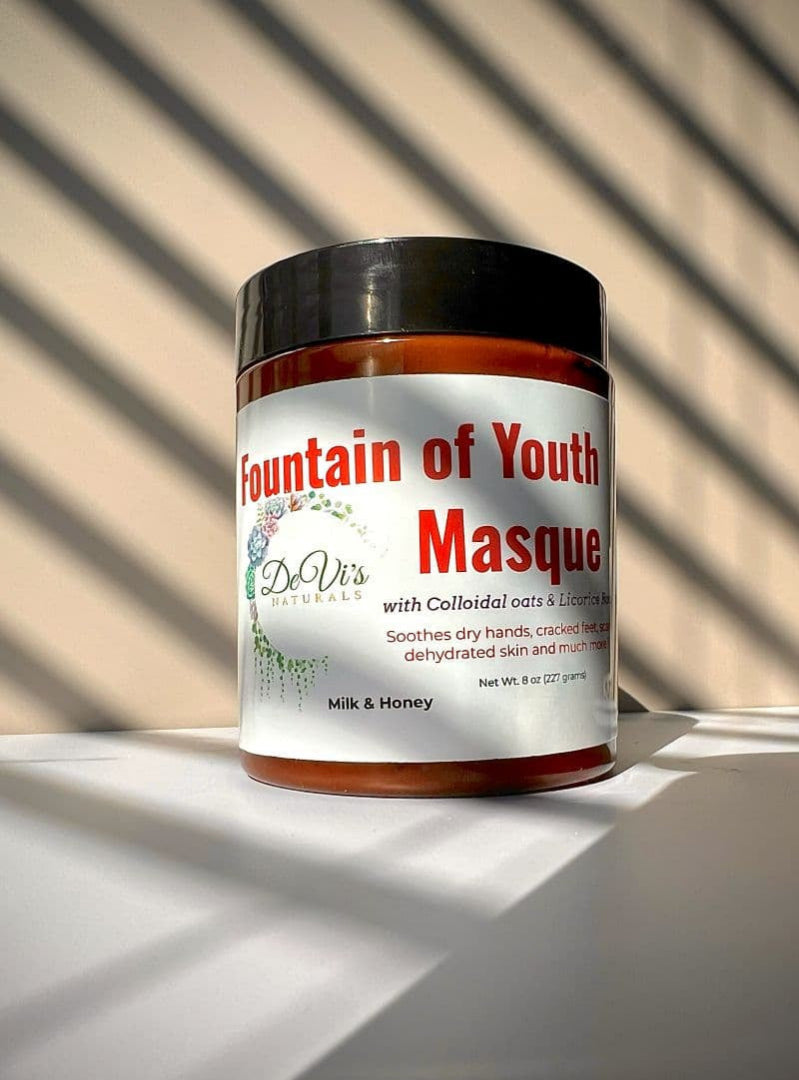 Jar of 'Fountain of Youth Masque' with a black lid on a light surface.