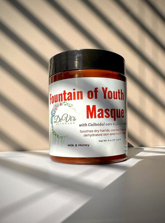 Jar of 'Fountain of Youth Masque' with a black lid on a light surface.