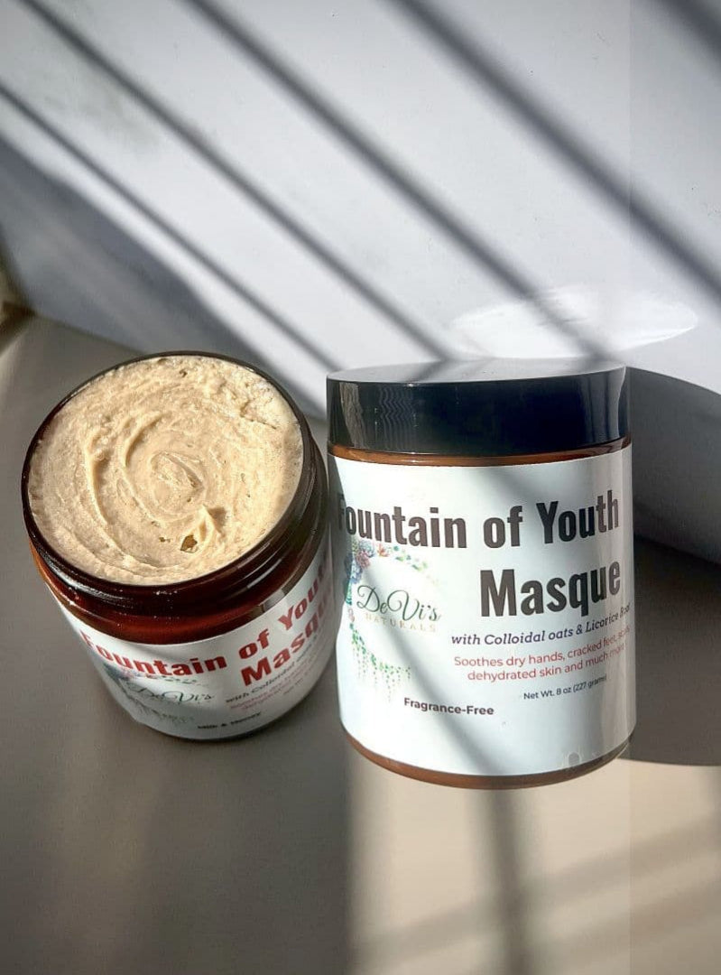 Jar of 'Mountain of Youth Masque' with its packaging on a reflective surface.