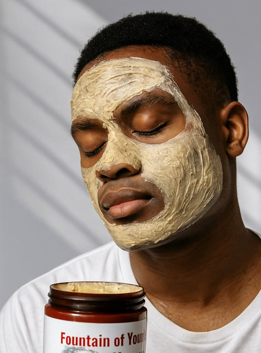 Man applying a facial mask with a jar labeled 'Fountain of Youth' on a neutral background