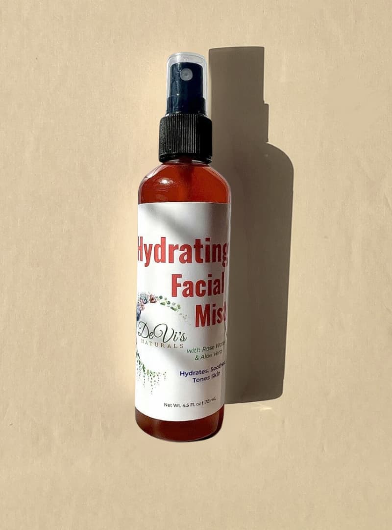 Hydrating Facial Mist bottle with label on a beige background