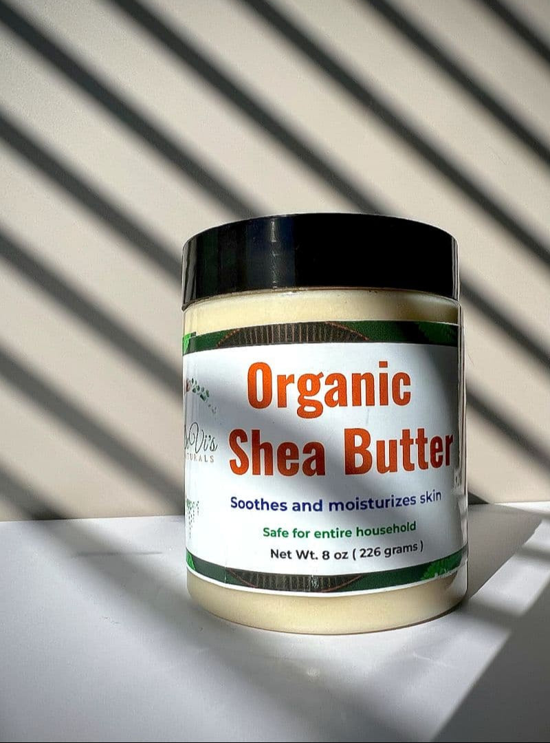 Jar of organic shea butter with a striped background